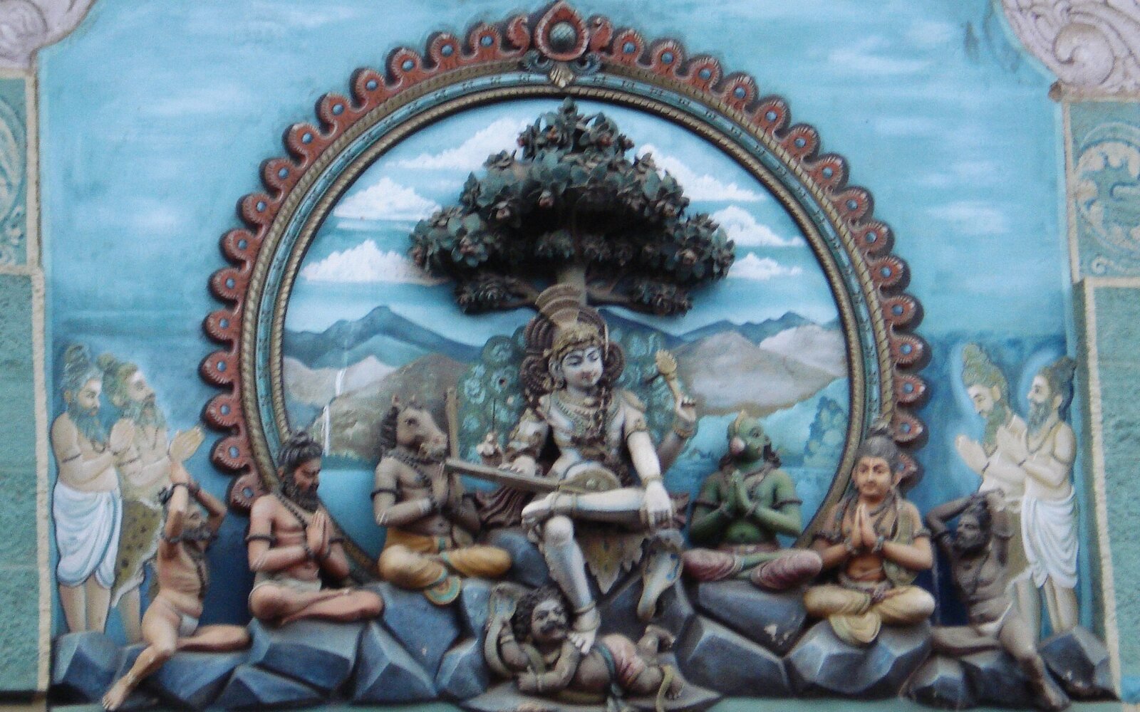 Temple sculpture of Dakshinamurthy, the divine teacher, with his disciples